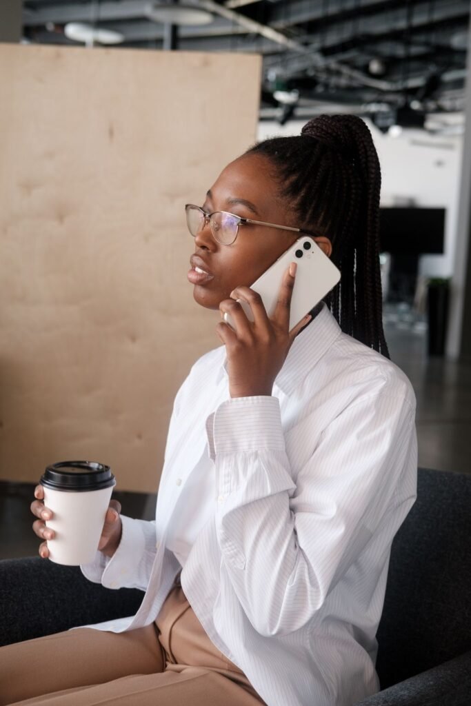 Businesswoman speaking on a smartphone in a modern office